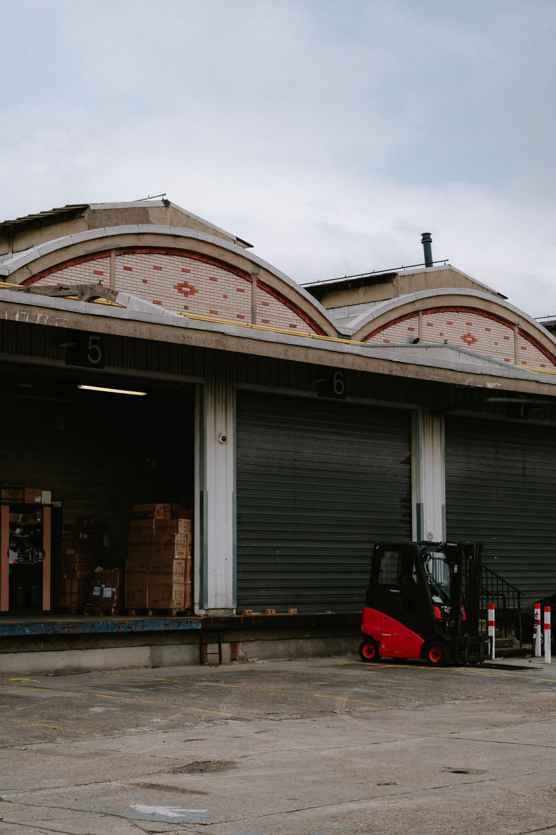 Warehouse loading bays and forklift prepared for shipment movement