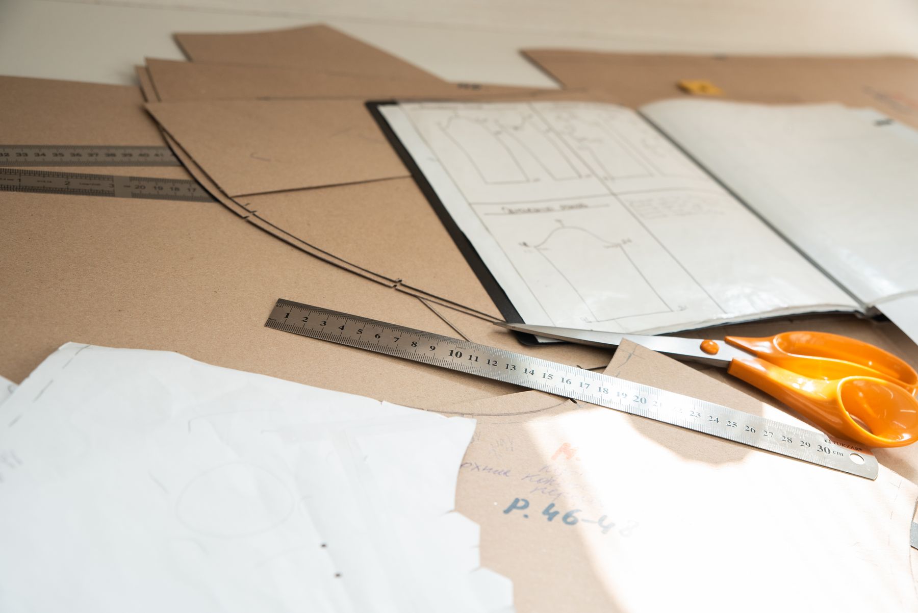 Garment patterns, measurement ruler and cutting tools used for technical development